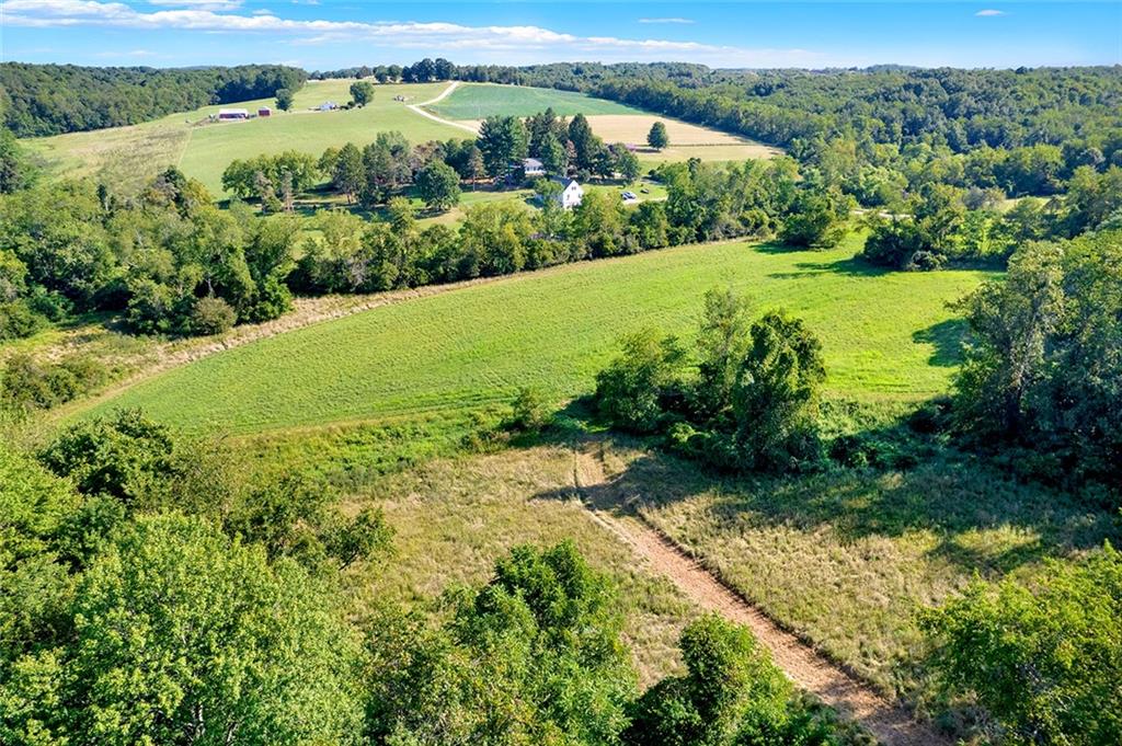 0 Bethelboro Road Uniontown, PA 15401 - Photo 3 of 12 an aerial view of green landscape with trees houses and lake view