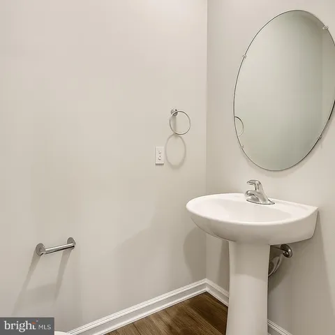 a bathroom with a sink and mirror