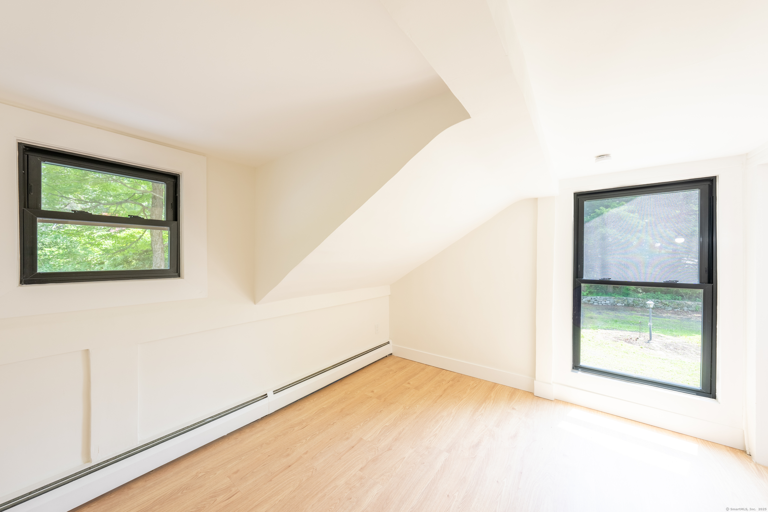 219 Redding Road Redding, CT 06896 - Photo 16 of 27 a view of an empty room with a window