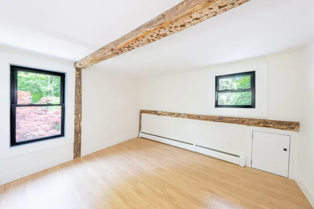 a view of an empty room with windows