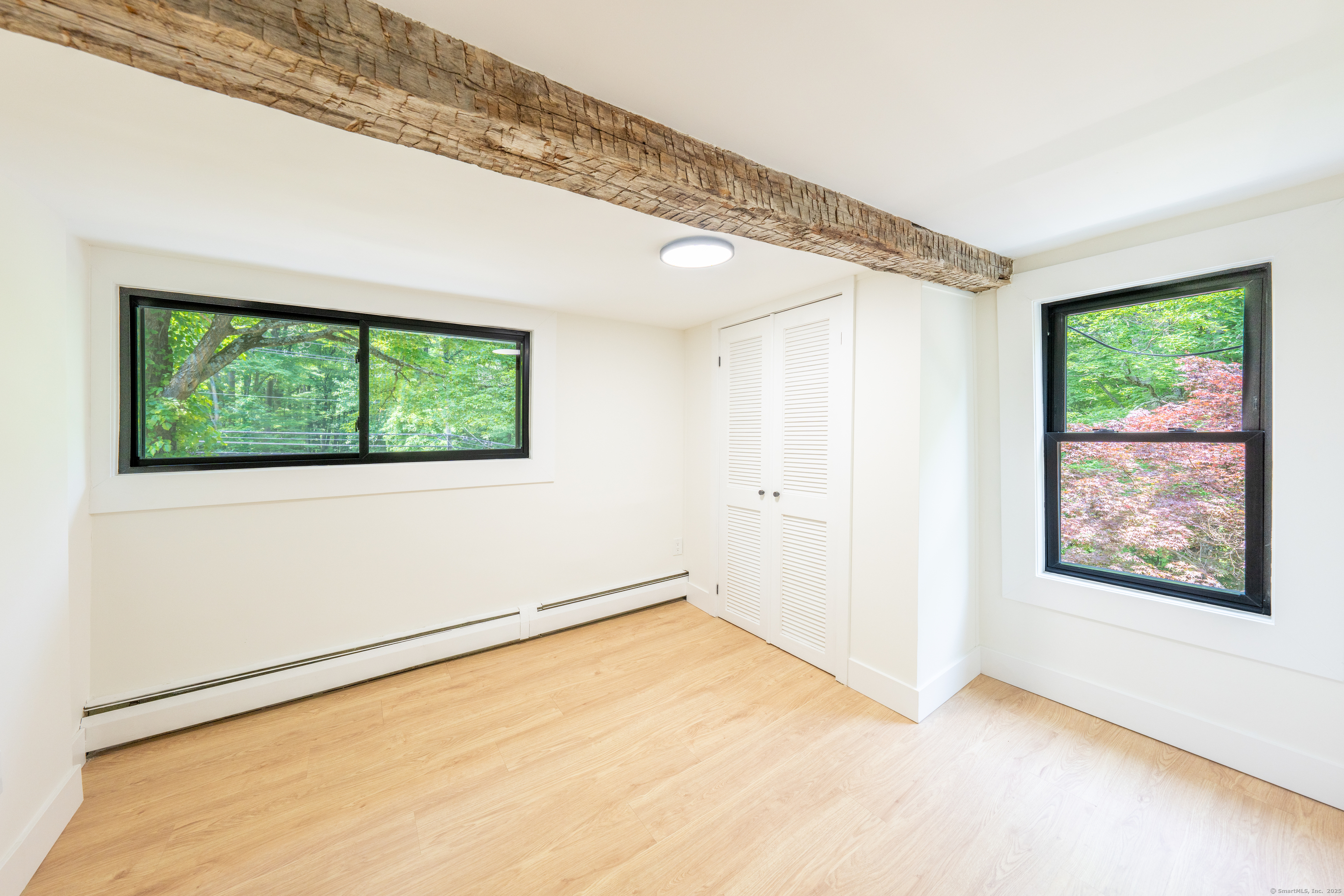 219 Redding Road Redding, CT 06896 - Photo 20 of 27 a view of an empty room with a window
