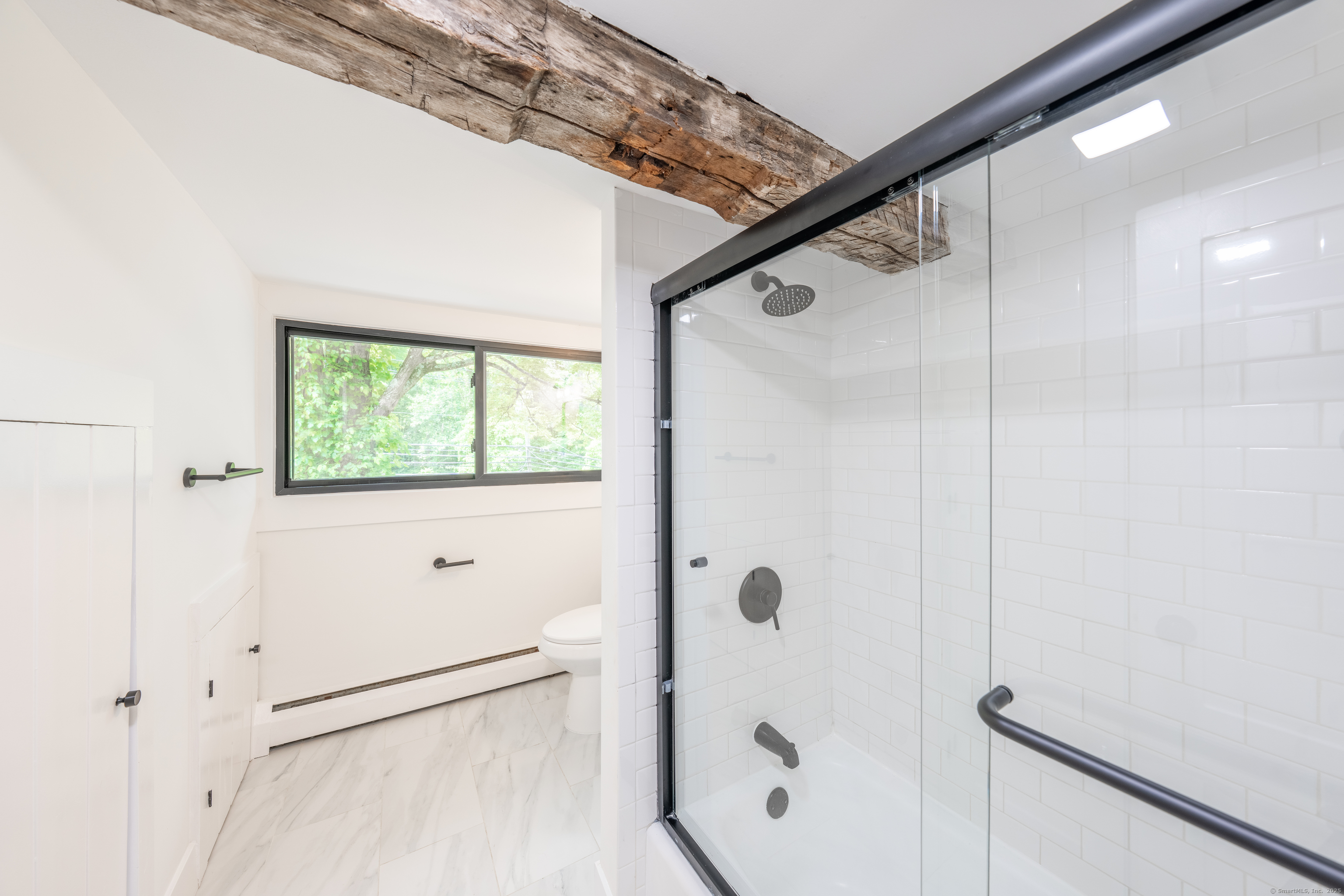 219 Redding Road Redding, CT 06896 - Photo 3 of 27 a bathroom with a glass shower door