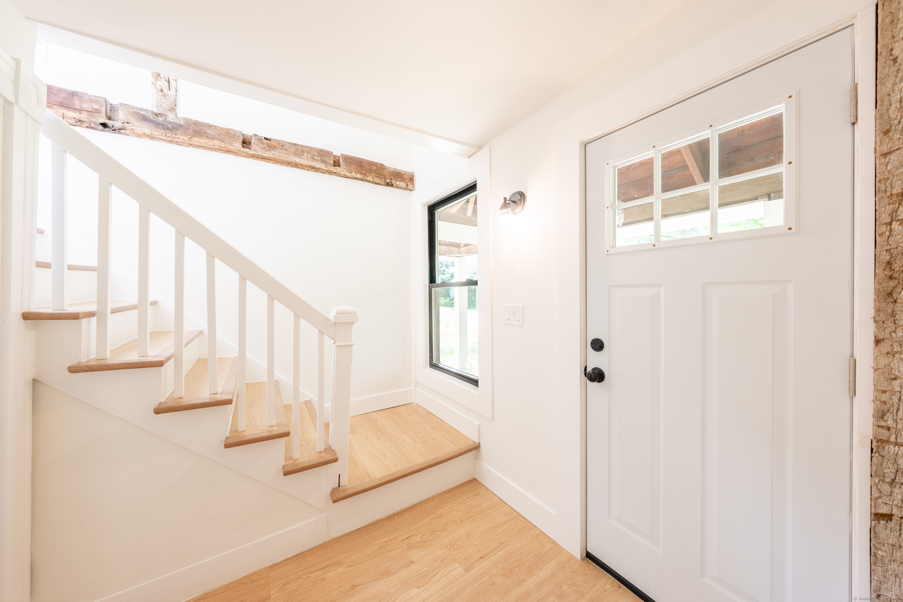 219 Redding Road Redding, CT 06896 - Photo 4 of 27 a view of entryway and hall with wooden floor