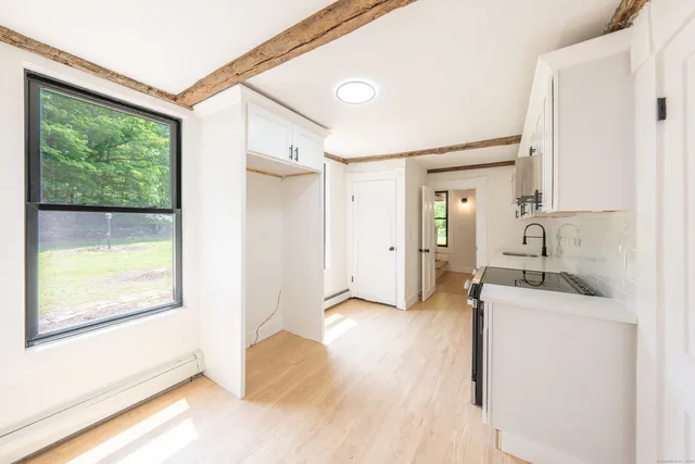 a view of a kitchen cabinets and a wooden floor