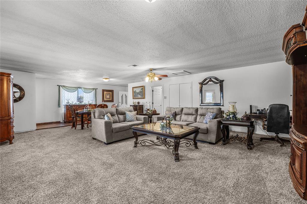748 Rocky Ridge Lane Weatherford, TX 76085 - Photo 22 of 38 a living room with furniture and a large window