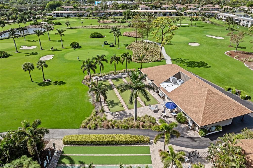 136 Harrison Road, Unit 1 Naples, FL 34112 - Photo 26 of 29 Expansive golf course setting featuring manicured greens and sand traps