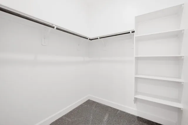 a view of an empty walk in closet
