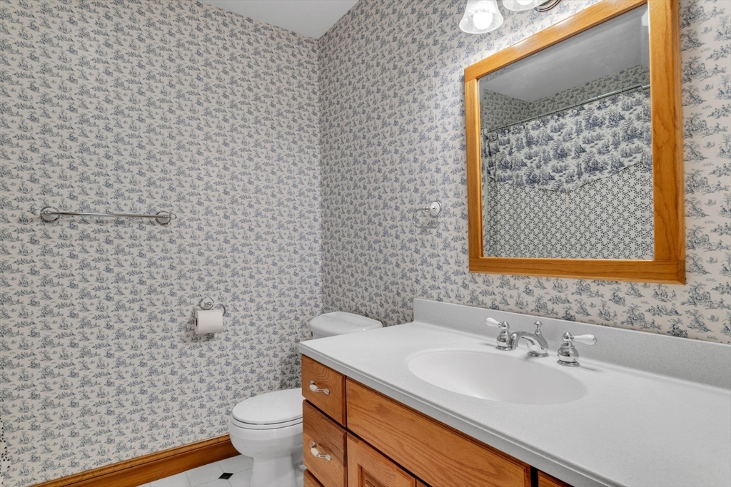 155 Orchard Road East Longmeadow, MA 01028 - Photo 26 of 42 a bathroom with a sink a toilet and mirror