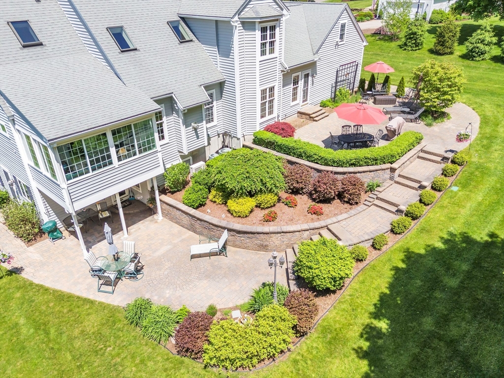 155 Orchard Road East Longmeadow, MA 01028 - Photo 3 of 42 a view of a white house with a yard and potted plants