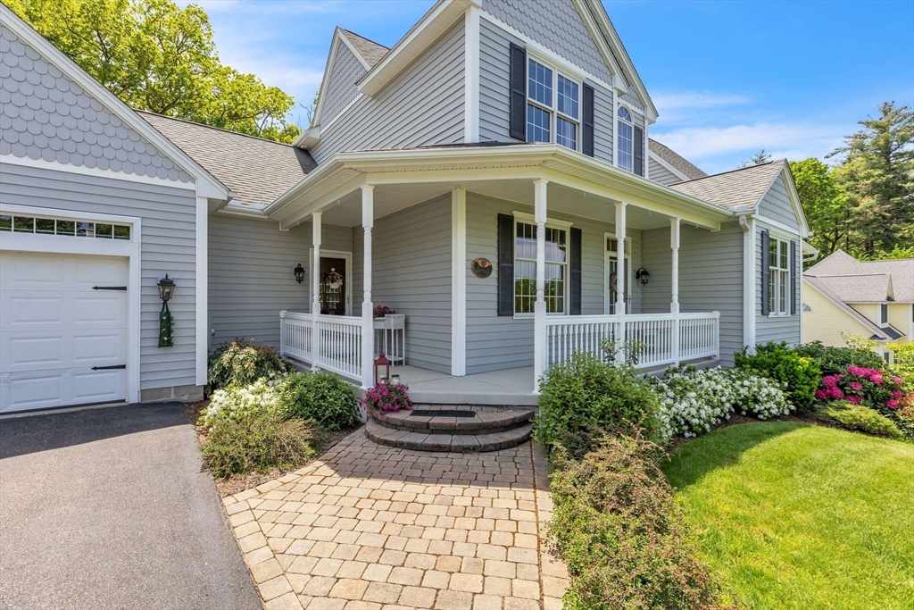 155 Orchard Road East Longmeadow, MA 01028 - Photo 4 of 42 a view of a house with potted plants and a table and chair