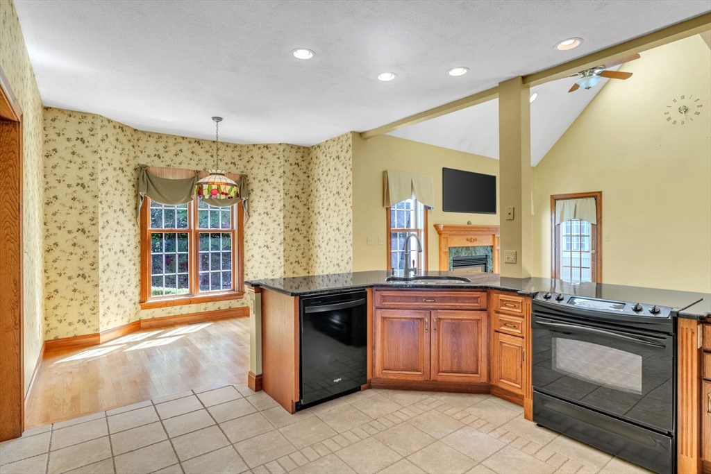 155 Orchard Road East Longmeadow, MA 01028 - Photo 5 of 42 a kitchen with a sink stove and cabinets