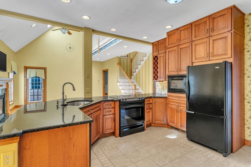 155 Orchard Road East Longmeadow, MA 01028 - Photo 6 of 42 a kitchen with stainless steel appliances granite countertop a refrigerator and a sink
