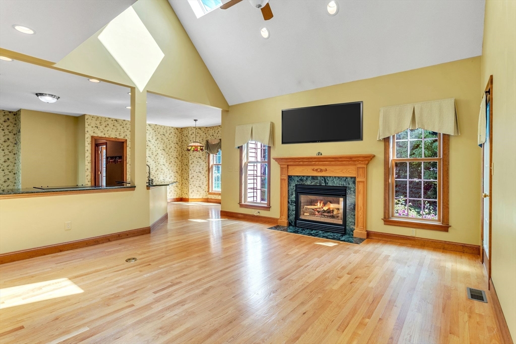 155 Orchard Road East Longmeadow, MA 01028 - Photo 9 of 42 a view of an empty room with wooden floor fireplace and a window