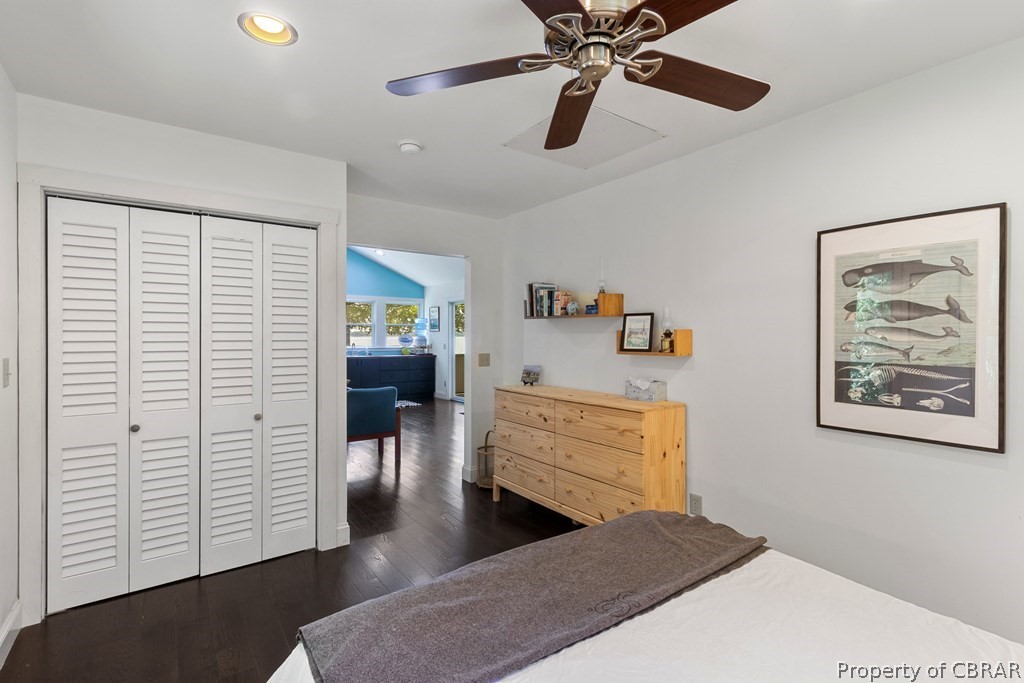 90 Bar Point Road Lancaster, VA 22503 - Photo 10 of 33 a bedroom with a bed and a chandelier