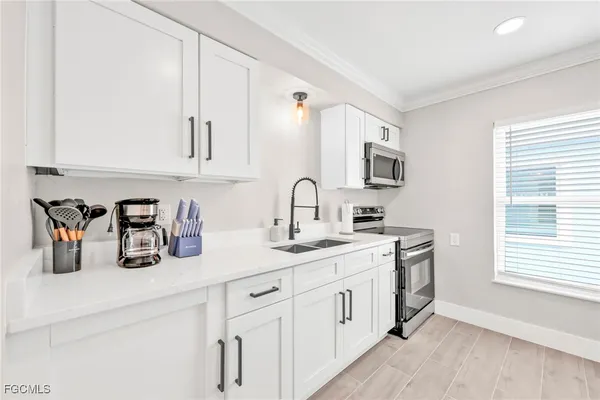 a bathroom with a sink a mirror and a shower curtain