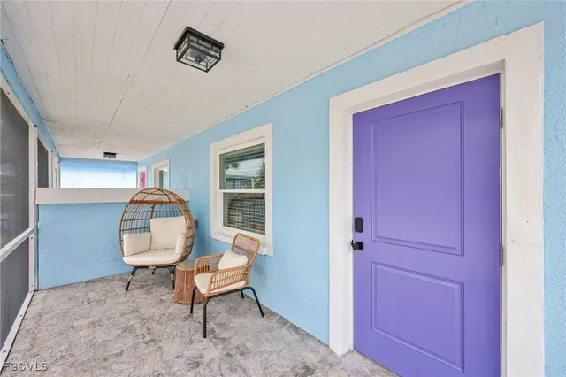 a bedroom with two beds and with view of kitchen