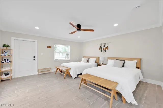 a bedroom with furniture and a window