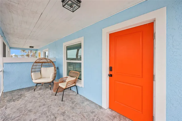 a bedroom with furniture and a chandelier