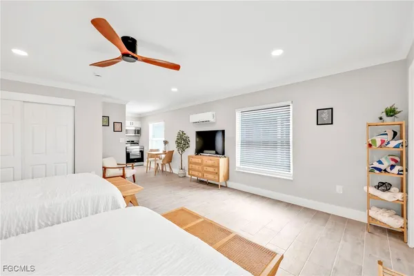 a bedroom with two beds and a table