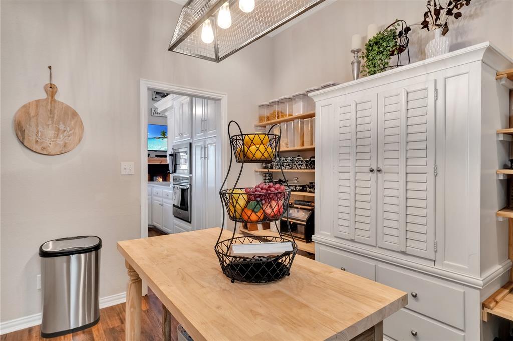 192 County Road 3133 Decatur, TX 76234 - Photo 12 of 35 a table with a vase and chandelier