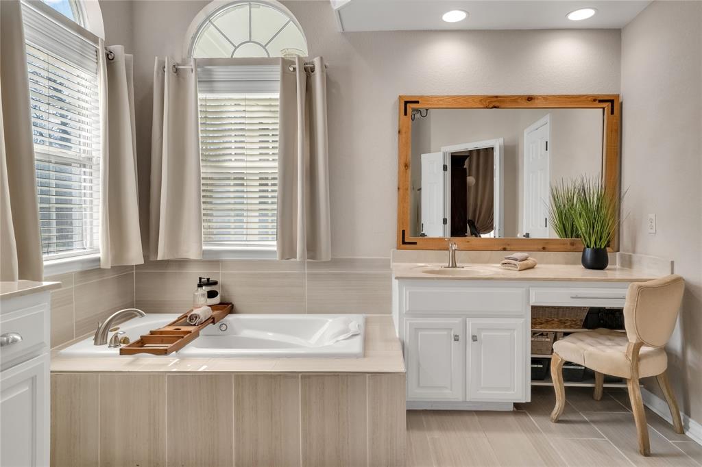 192 County Road 3133 Decatur, TX 76234 - Photo 15 of 35 a bathroom with a sink and a mirror