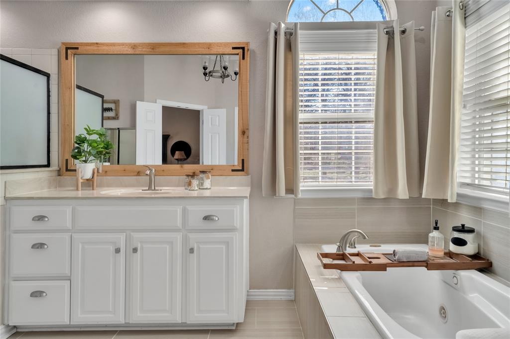192 County Road 3133 Decatur, TX 76234 - Photo 16 of 35 a bathroom with a sink and a window
