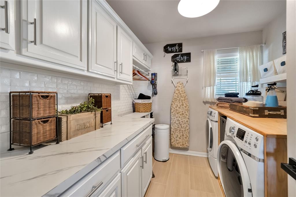 192 County Road 3133 Decatur, TX 76234 - Photo 21 of 35 a kitchen with stainless steel appliances a stove a sink and a refrigerator