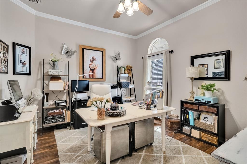 192 County Road 3133 Decatur, TX 76234 - Photo 22 of 35 a living room with furniture a table and painting on the wall