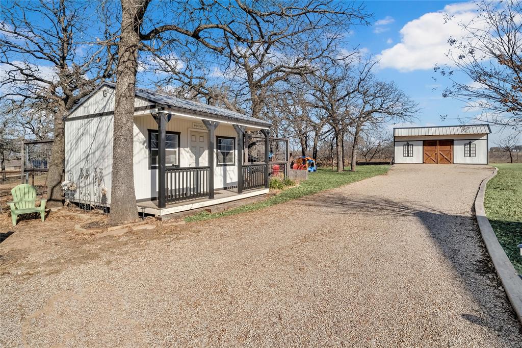 192 County Road 3133 Decatur, TX 76234 - Photo 30 of 35 a view of a house with a large tree and a yard