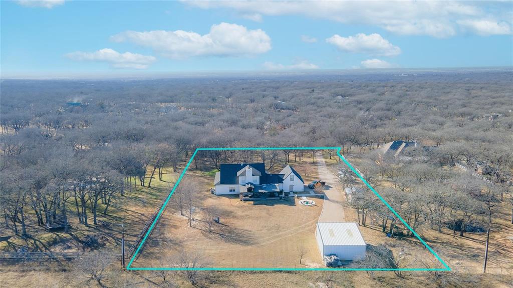 192 County Road 3133 Decatur, TX 76234 - Photo 34 of 35 a view of a balcony with two chairs and a fire pit