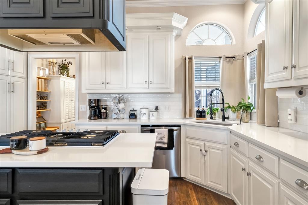 192 County Road 3133 Decatur, TX 76234 - Photo 4 of 35 a kitchen with a table chairs sink and cabinets