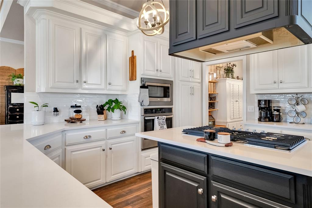 192 County Road 3133 Decatur, TX 76234 - Photo 5 of 35 a kitchen with granite countertop white cabinets and white appliances