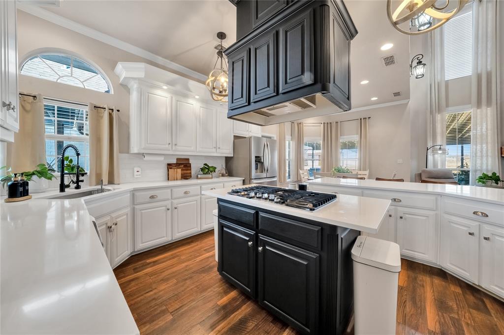 192 County Road 3133 Decatur, TX 76234 - Photo 7 of 35 a kitchen with stainless steel appliances granite countertop a stove a sink and a refrigerator