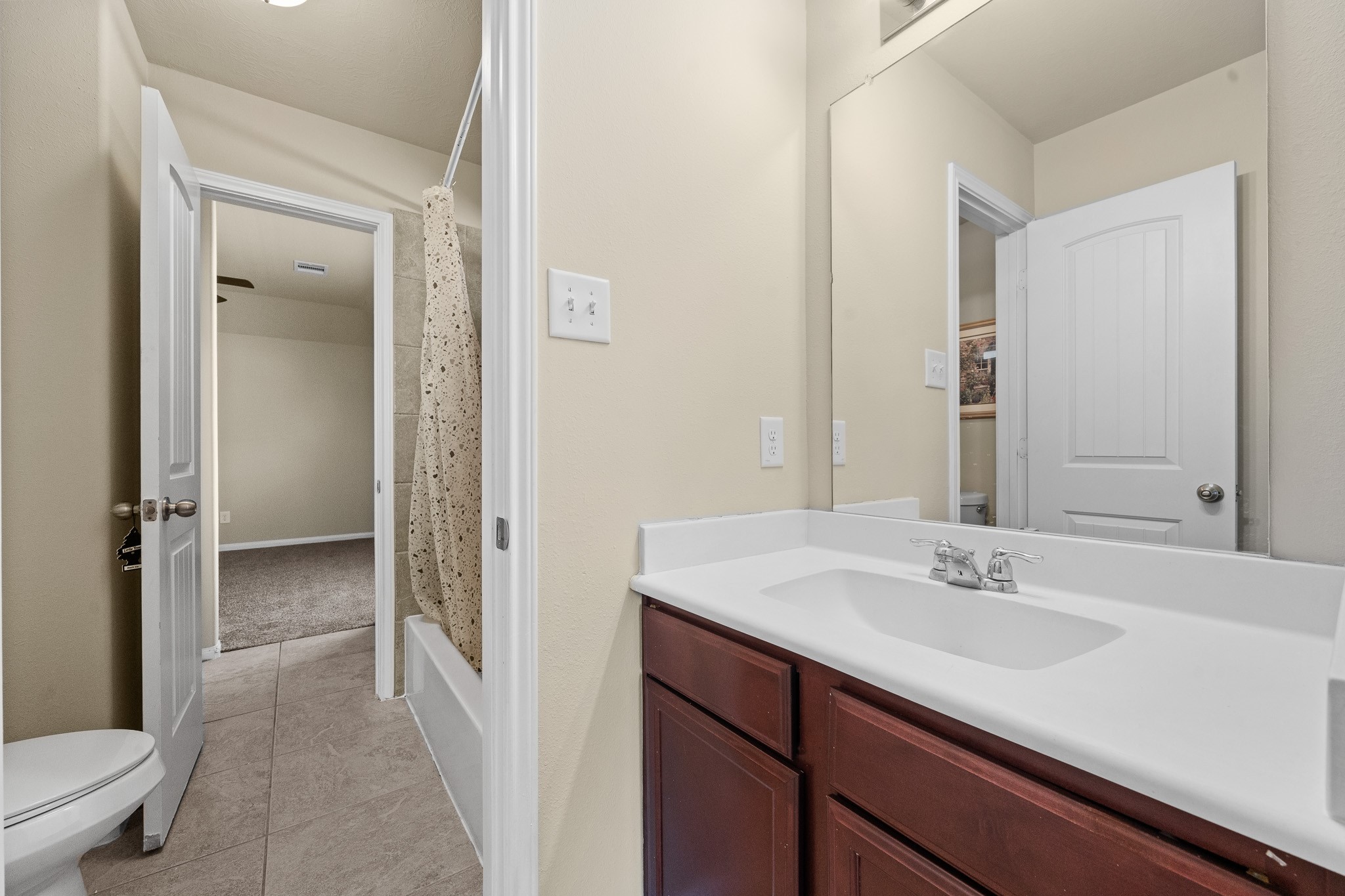 24735 Colonial Maple Drive Katy, TX 77493 - Photo 14 of 32 a bathroom with a sink double vanity and a toilet