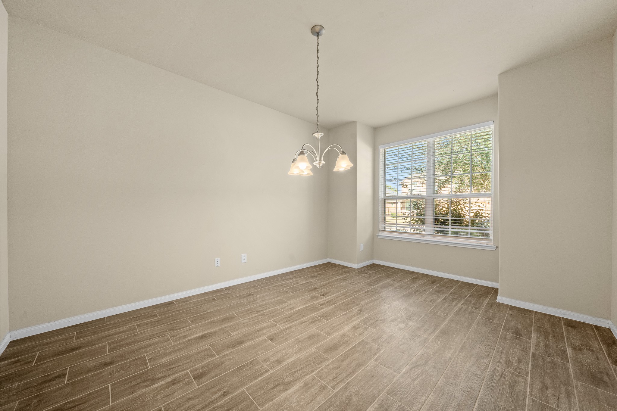 24735 Colonial Maple Drive Katy, TX 77493 - Photo 17 of 32 a view of a room with wooden floor and a window
