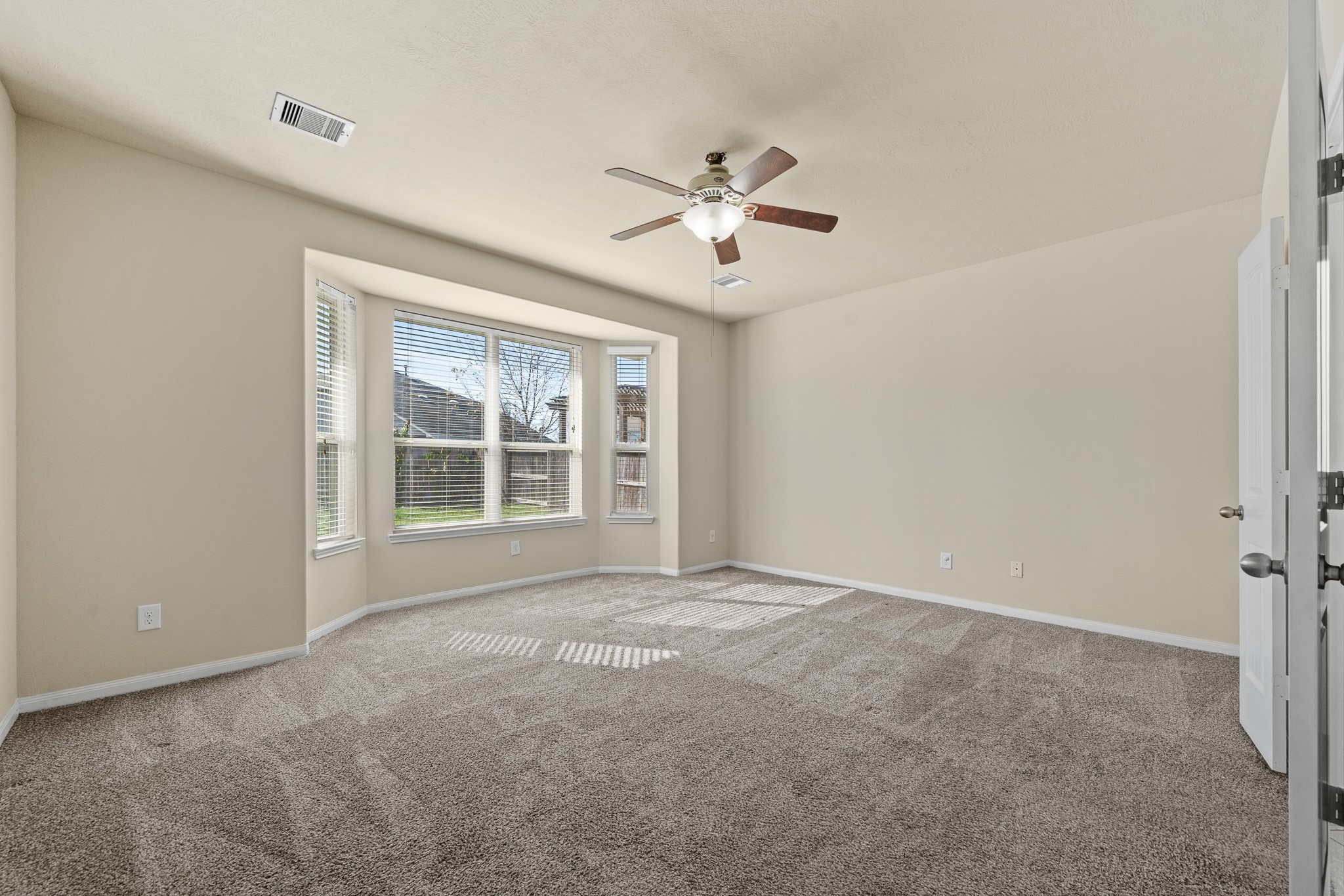 24735 Colonial Maple Drive Katy, TX 77493 - Photo 21 of 32 a view of an empty room with a window