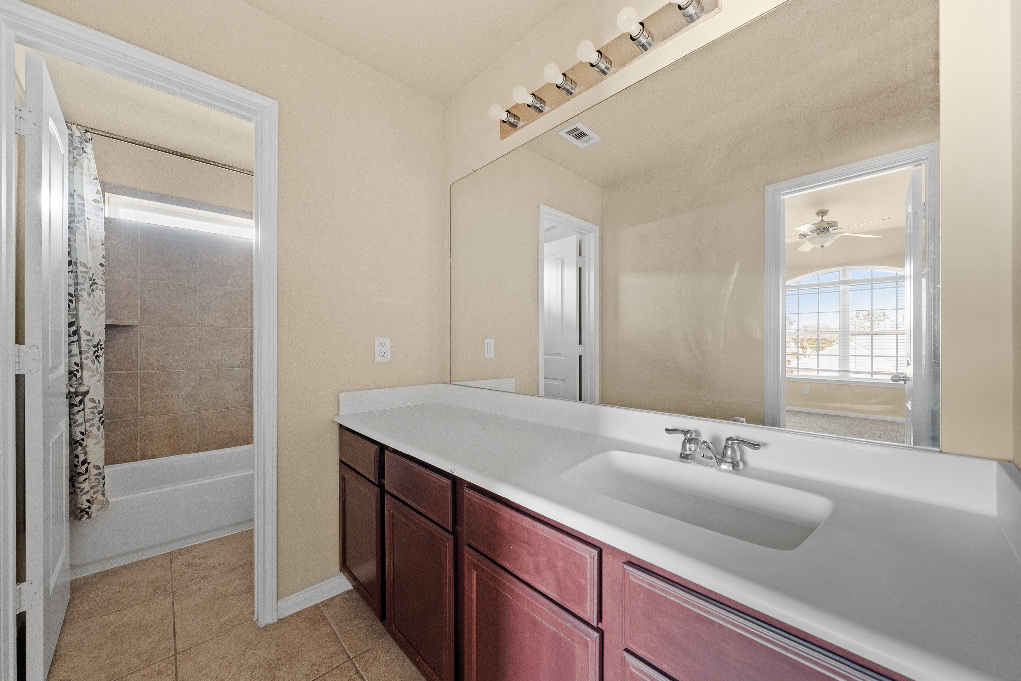 24735 Colonial Maple Drive Katy, TX 77493 - Photo 22 of 32 a bathroom with a sink and a mirror