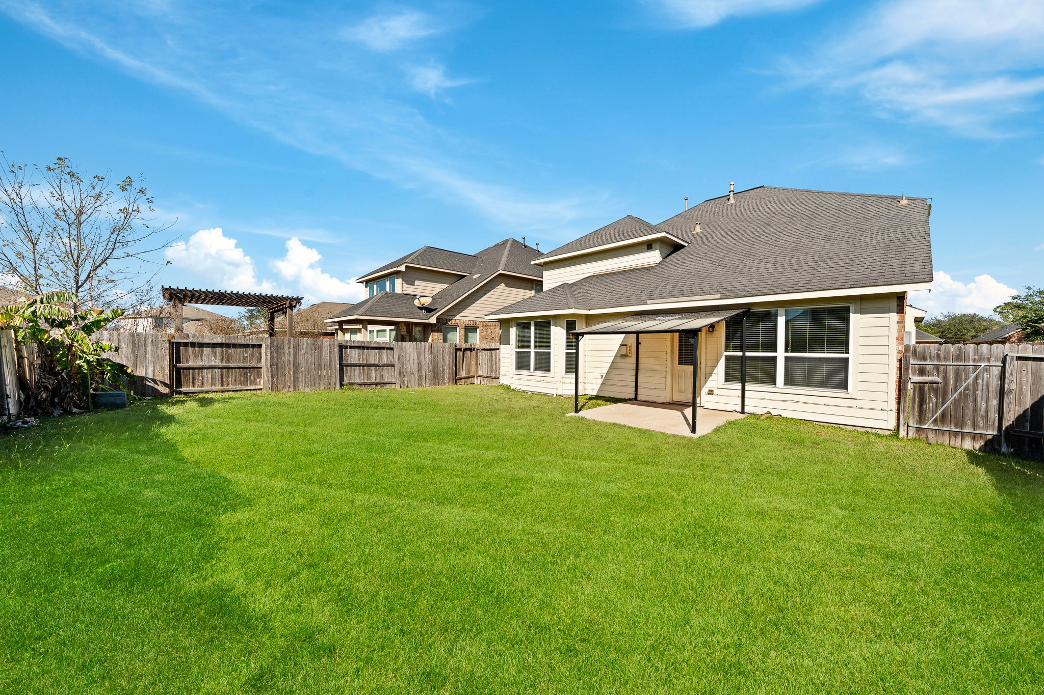 24735 Colonial Maple Drive Katy, TX 77493 - Photo 24 of 32 a view of a house with a yard and sitting area