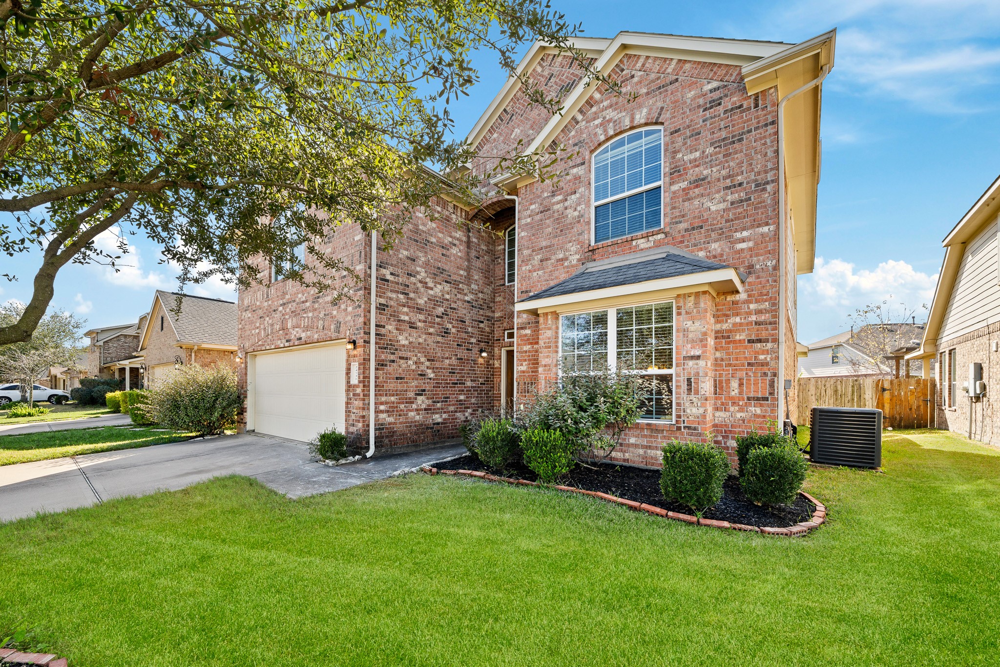 24735 Colonial Maple Drive Katy, TX 77493 - Photo 29 of 32 a view of a brick building next to a yard