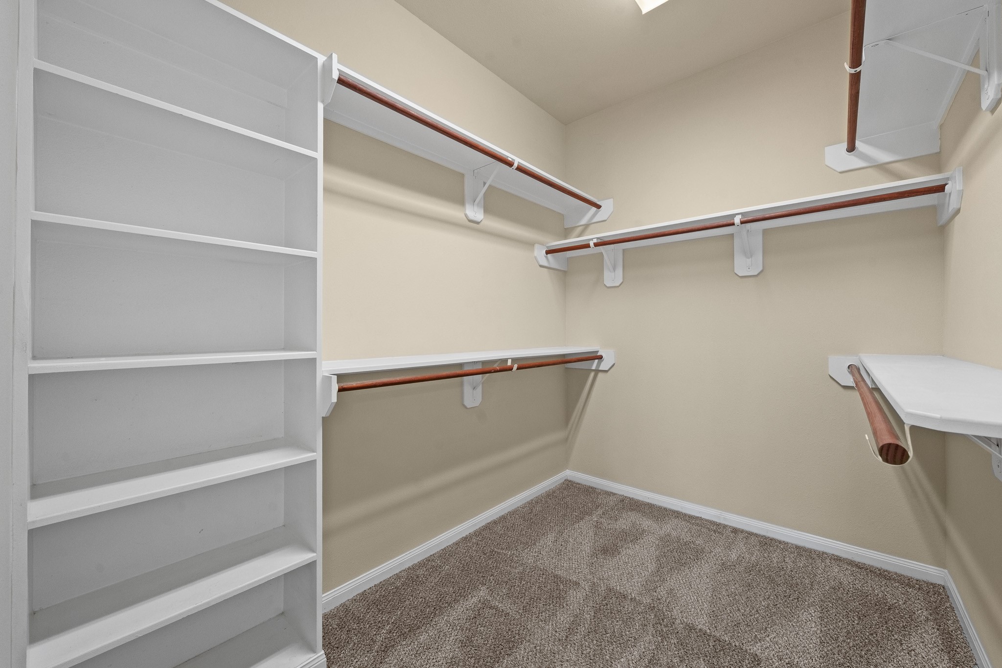 24735 Colonial Maple Drive Katy, TX 77493 - Photo 5 of 32 a view of an empty walk in closet