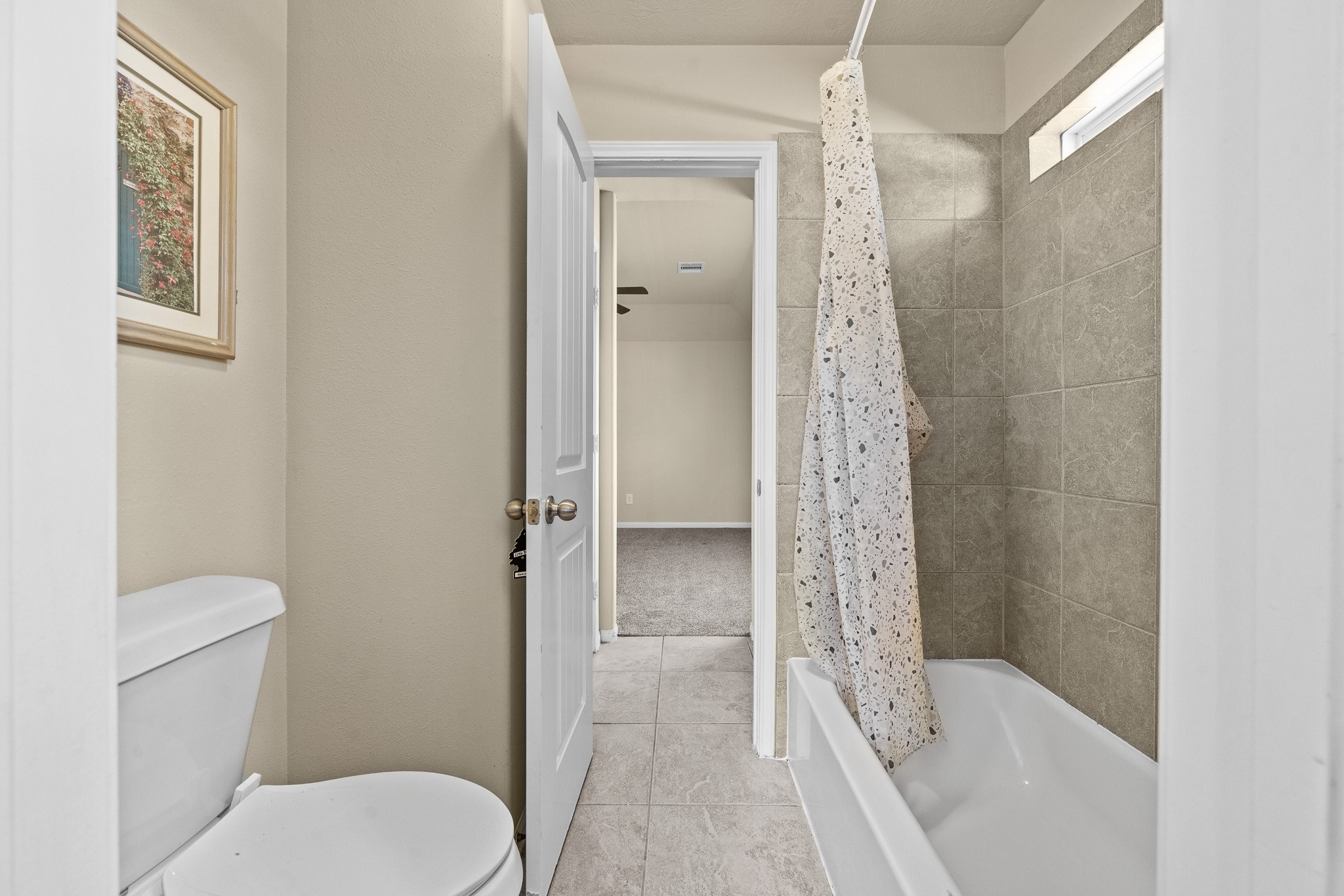 24735 Colonial Maple Drive Katy, TX 77493 - Photo 9 of 32 a bathroom with a shower a toilet and a sink