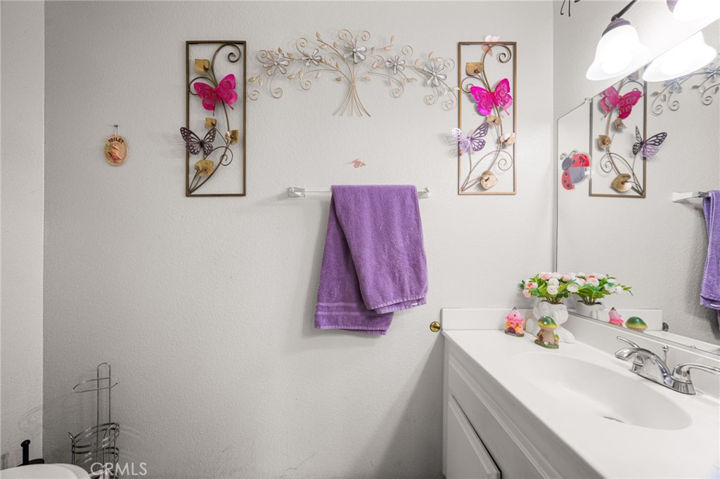 14134 Orizaba Avenue Paramount, CA 90723 - Photo 11 of 24 a bathroom with a sink and a mirror