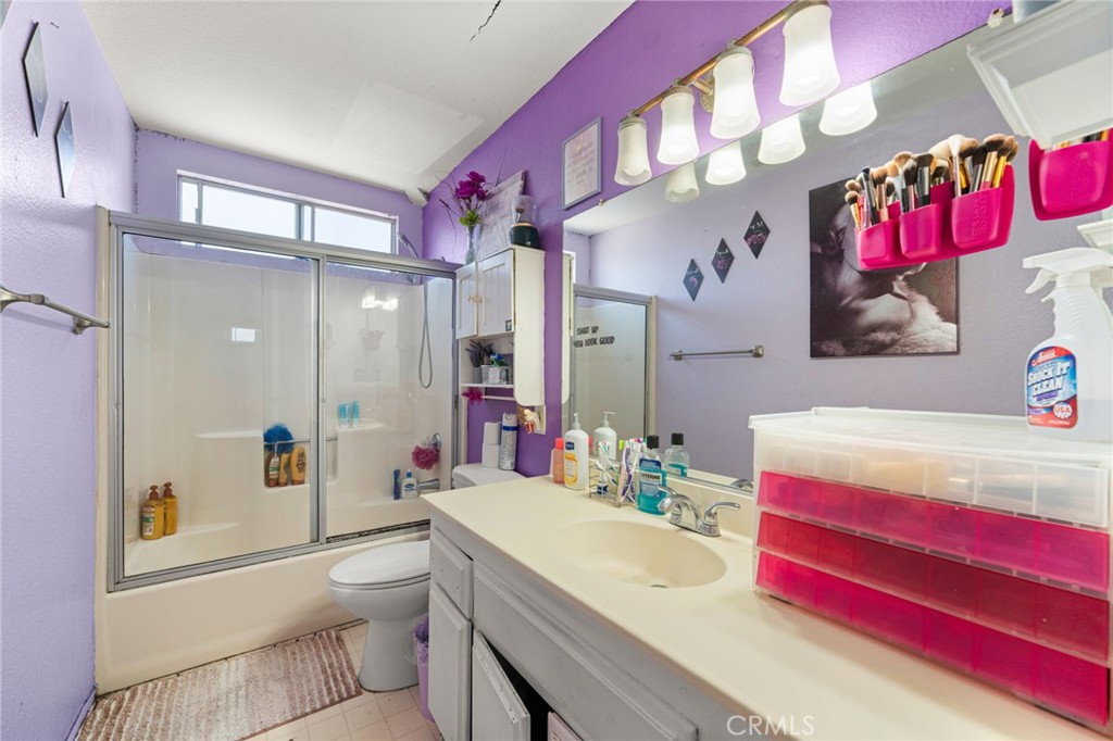 14134 Orizaba Avenue Paramount, CA 90723 - Photo 12 of 24 a bathroom with a sink vanity mirror and toilet