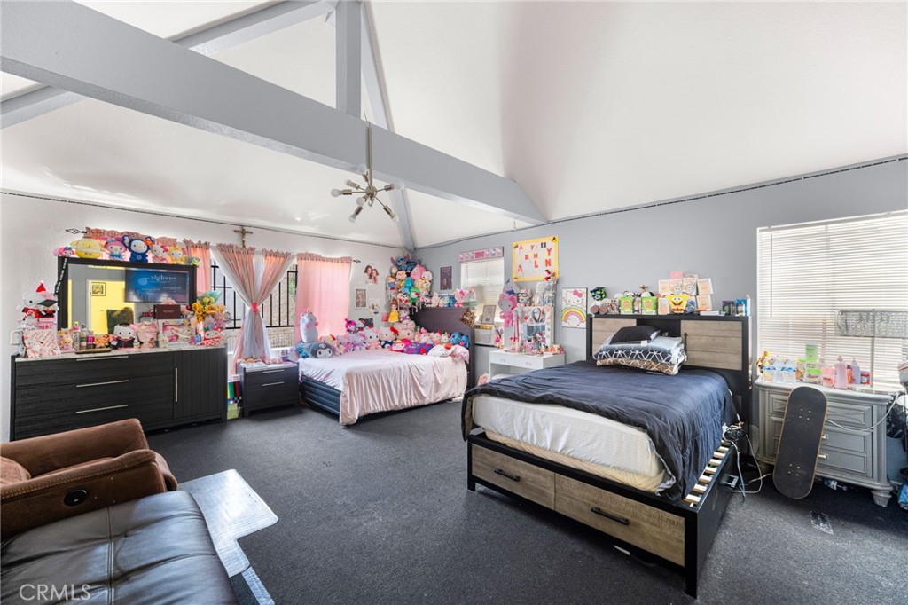 14134 Orizaba Avenue Paramount, CA 90723 - Photo 17 of 24 a bedroom with bed and window