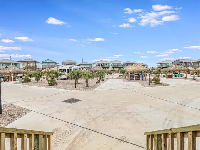 a kitchen with stainless steel appliances granite countertop a stove a refrigerator and a cabinets