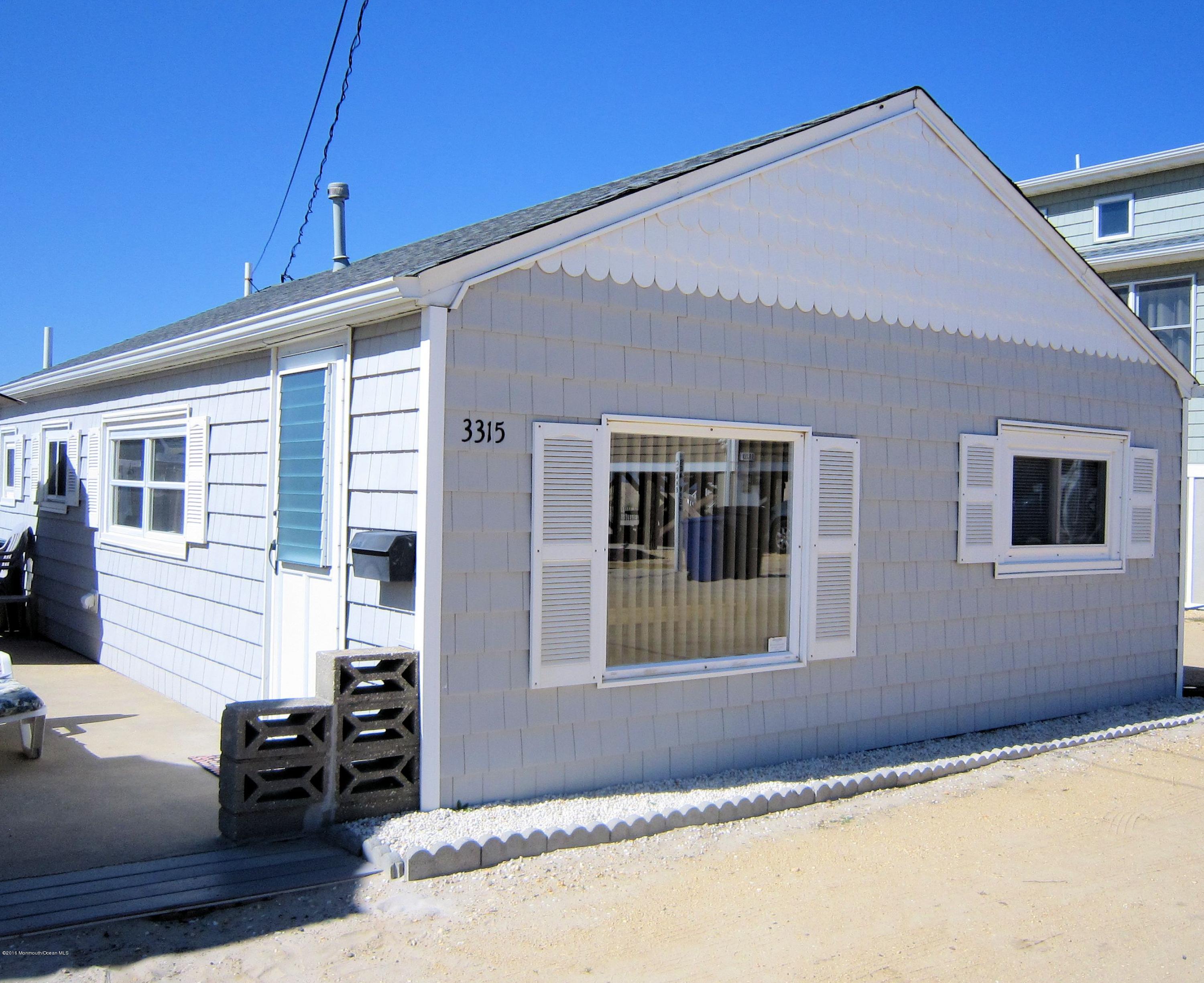 3315 Seaview Road Lavallette, NJ 08735 - Photo 1 of 8 a front view of a house