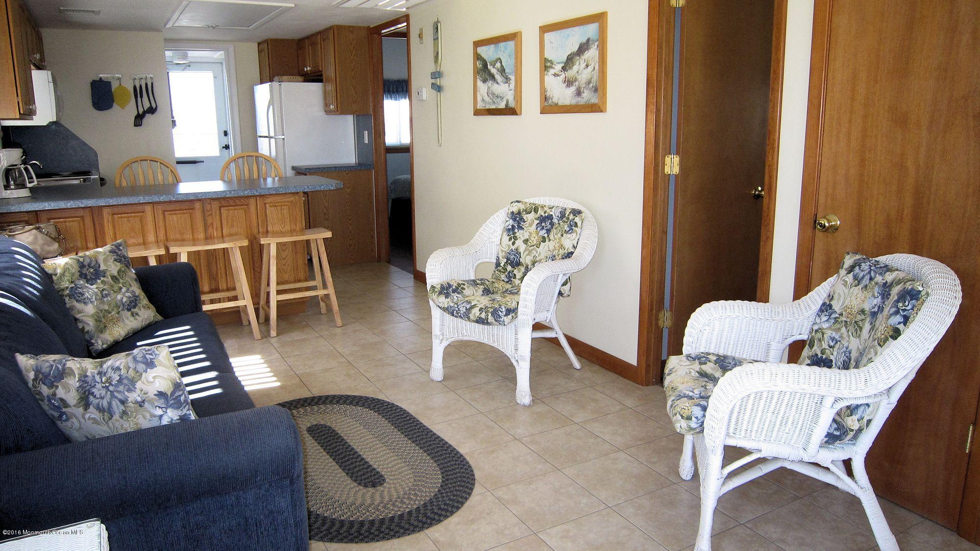 3315 Seaview Road Lavallette, NJ 08735 - Photo 3 of 8 a living room with furniture and a rug