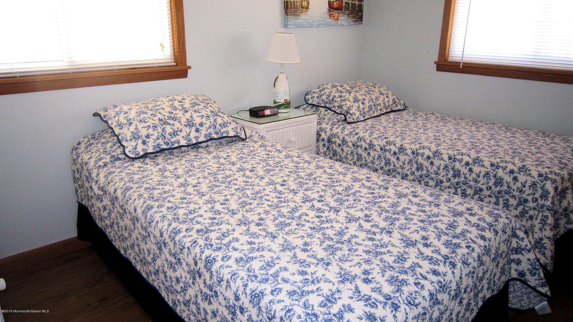3315 Seaview Road Lavallette, NJ 08735 - Photo 8 of 8 a bedroom with bed and a window