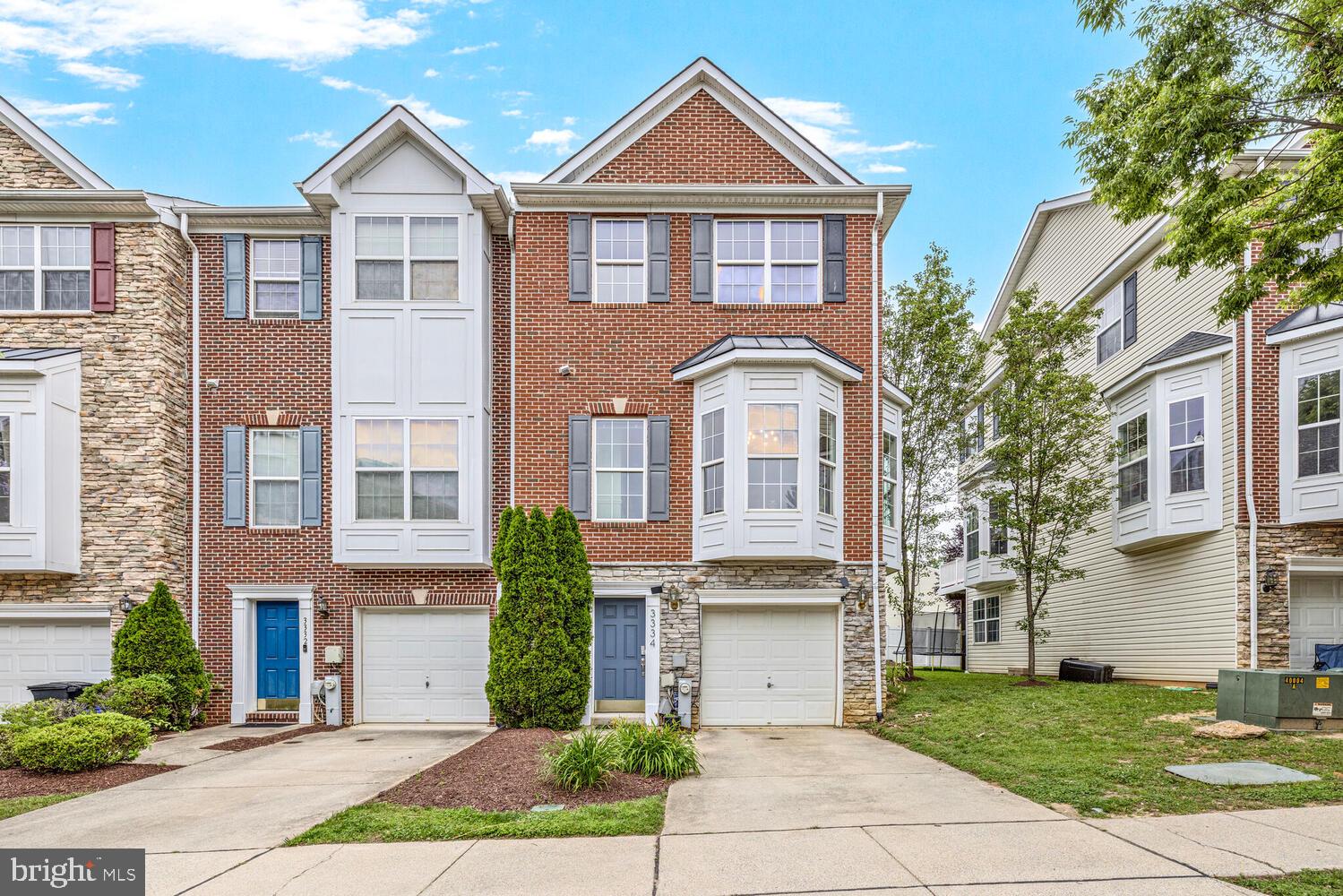3334 Castle Ridge Circle, Unit 8 Silver Spring, MD 20904 - Photo 1 of 32 a front view of a house with a yard