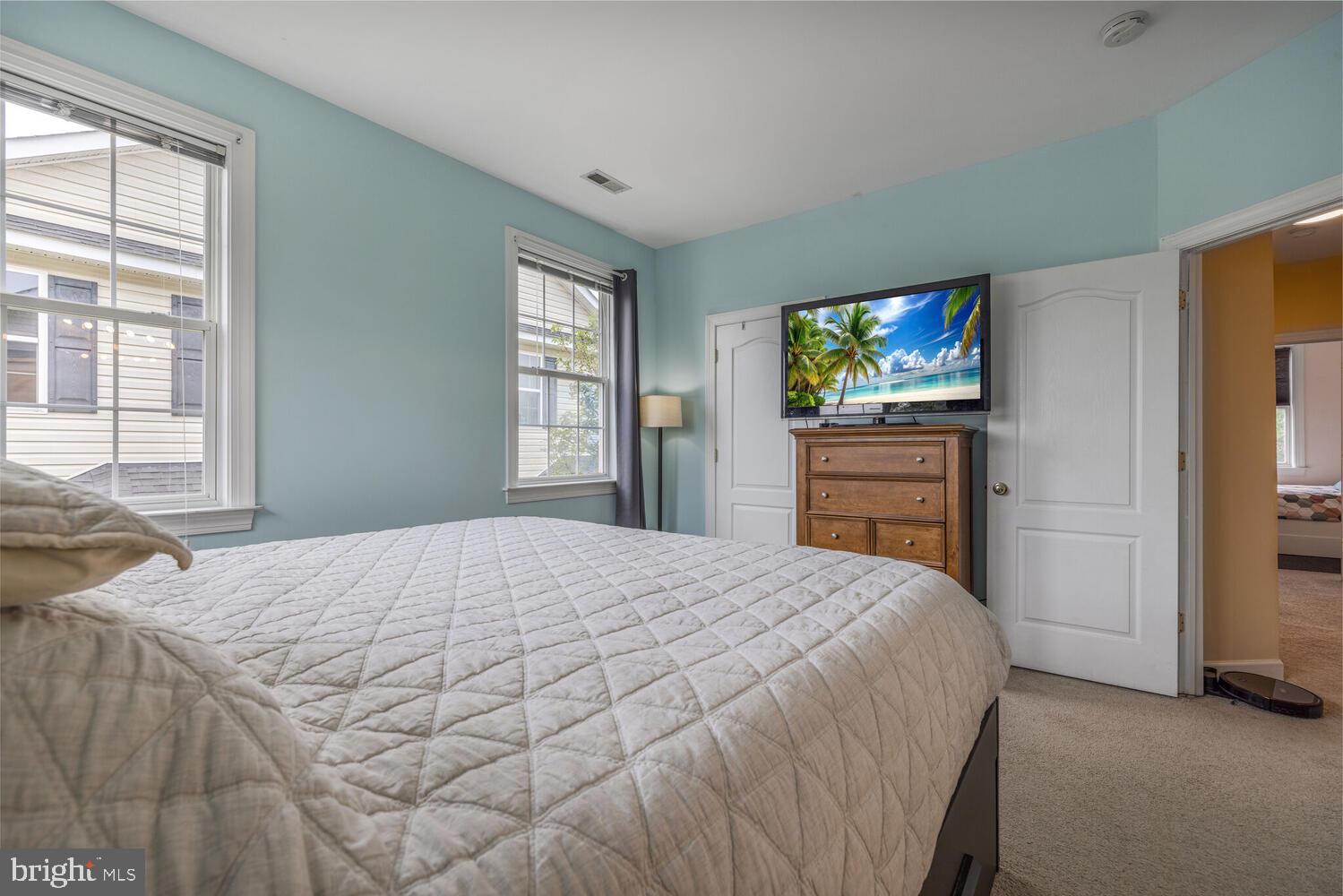 3334 Castle Ridge Circle, Unit 8 Silver Spring, MD 20904 - Photo 12 of 32 a bedroom with a bed and a flat screen tv